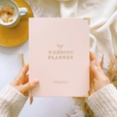 Photograph: Blush and Gold Luxury Wedding Planner Book with Gilded Edges