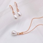 Photograph: Dolci Rose Gold Crystal and Teardrop Pearl Bridal Jewelry Set