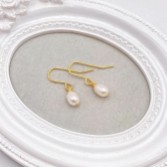 Photograph: Hermione Harbutt Starlight Gold Pearl Drop Earrings