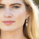 Photograph: Ivory and Co Rochelle Gold Crystal Pave Triple Drop Earrings