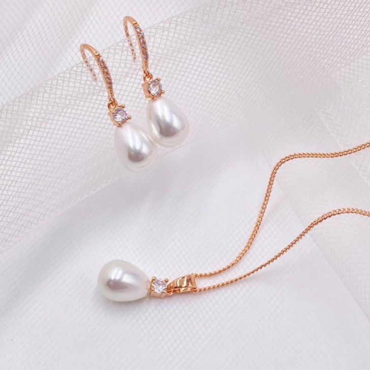 Conjunto de joyas nupciales «Dolci» en oro rosa con cristales y perlas en forma de lágrima