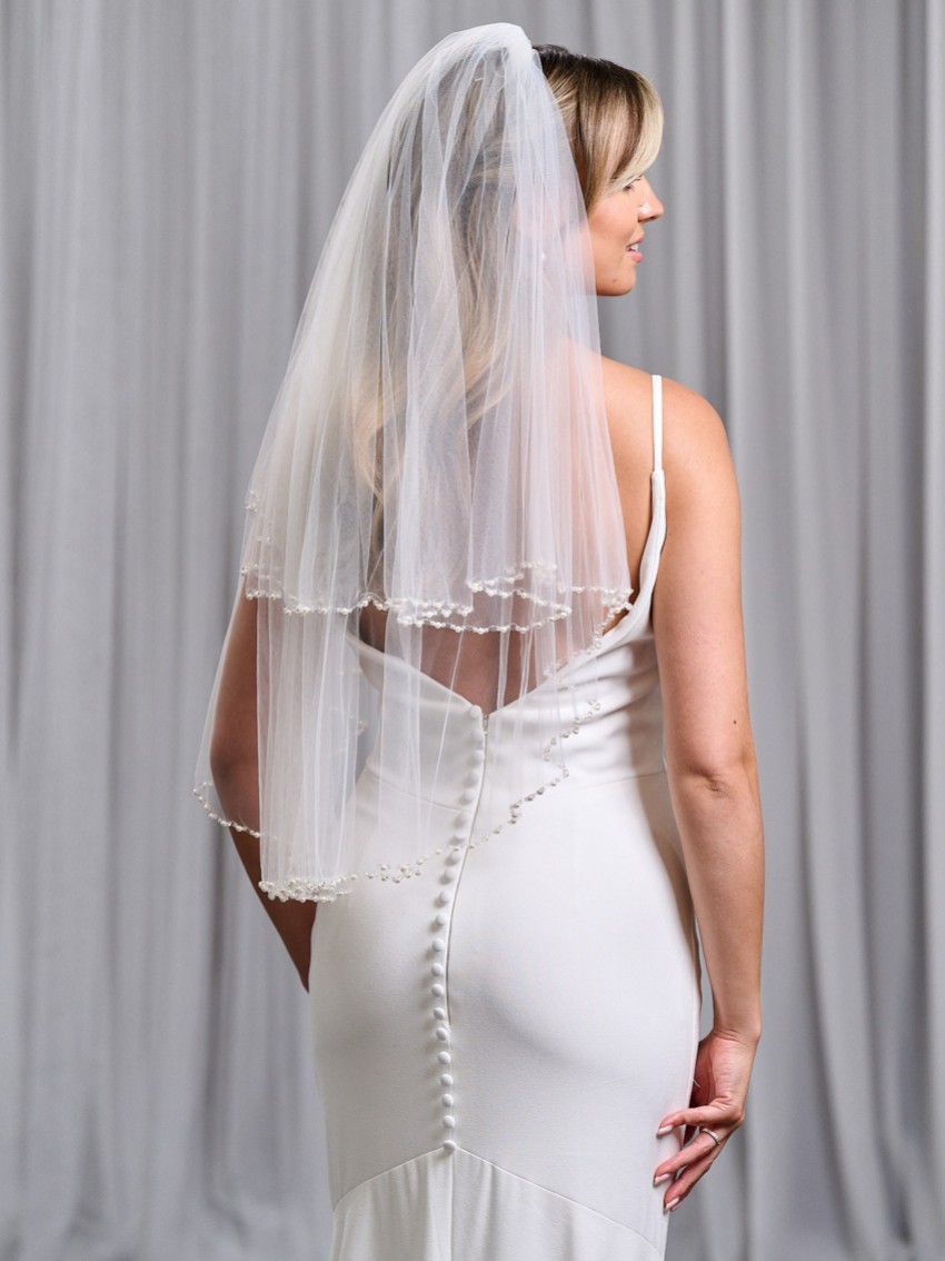 Photograph: Charleston Ivory Two Tier Bead, Diamante and Pearl Edge Elbow Length Veil