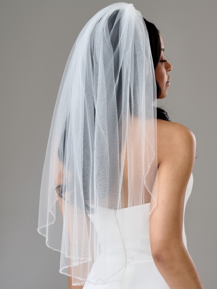 Photograph: Elmira Ivory Single Tier Delicate Beaded Edge Veil