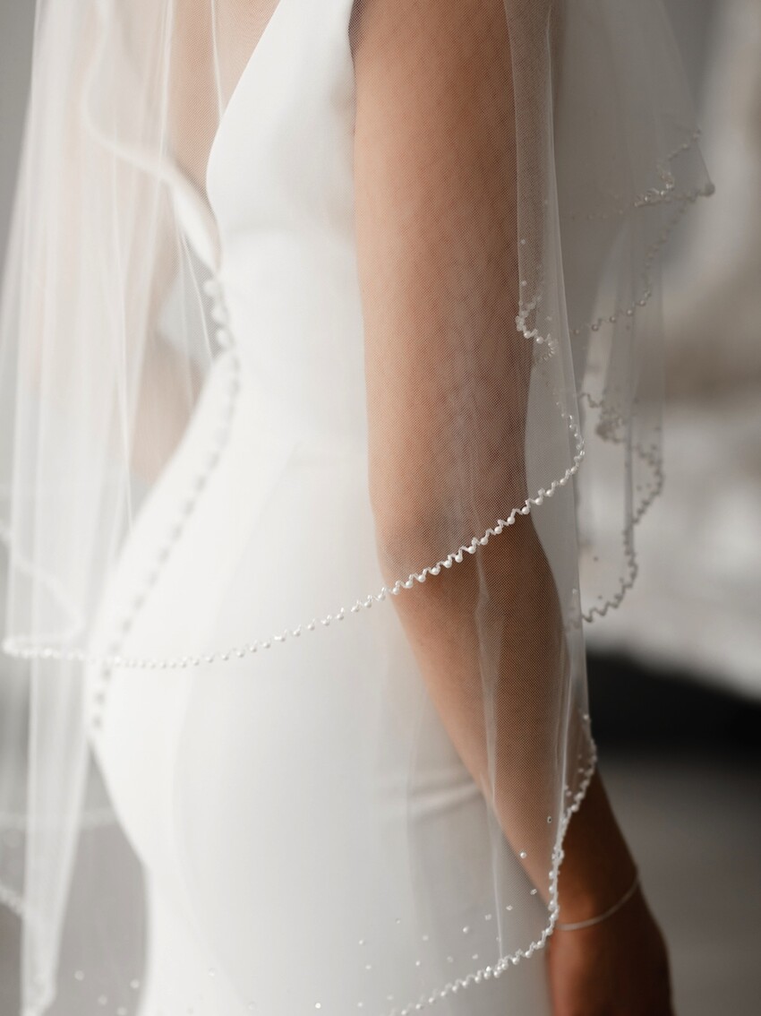 Photograph: Monterey Two Tier Pearl Edge Ivory Tulle Fingertip Veil TLV8503