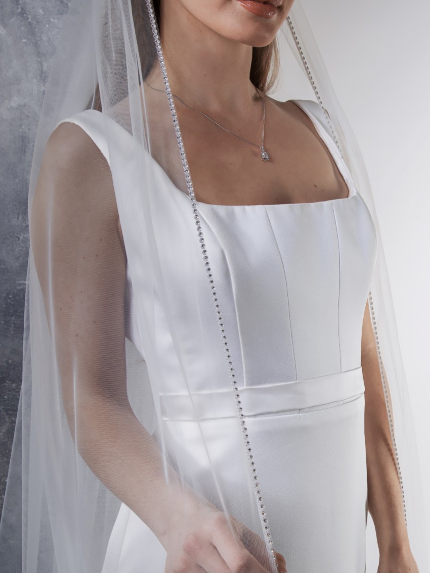 Photograph: Rainbow Club Flame Ivory Diamante Edge Chapel Length Veil