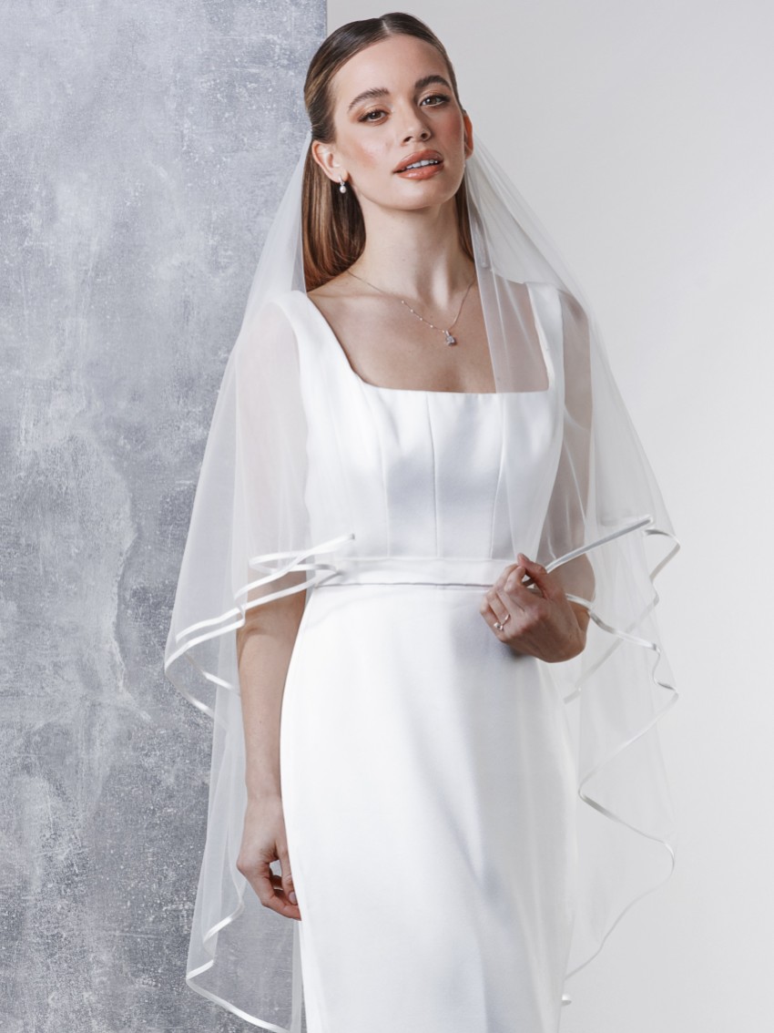 Photograph: Rainbow Club Jessamy Ivory Two Tier Satin Edge Veil