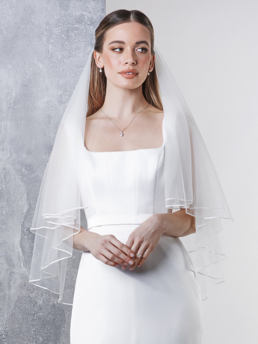 Photograph: Rainbow Club Tosca Ivory Two Tier Russian Braid Edge Veil