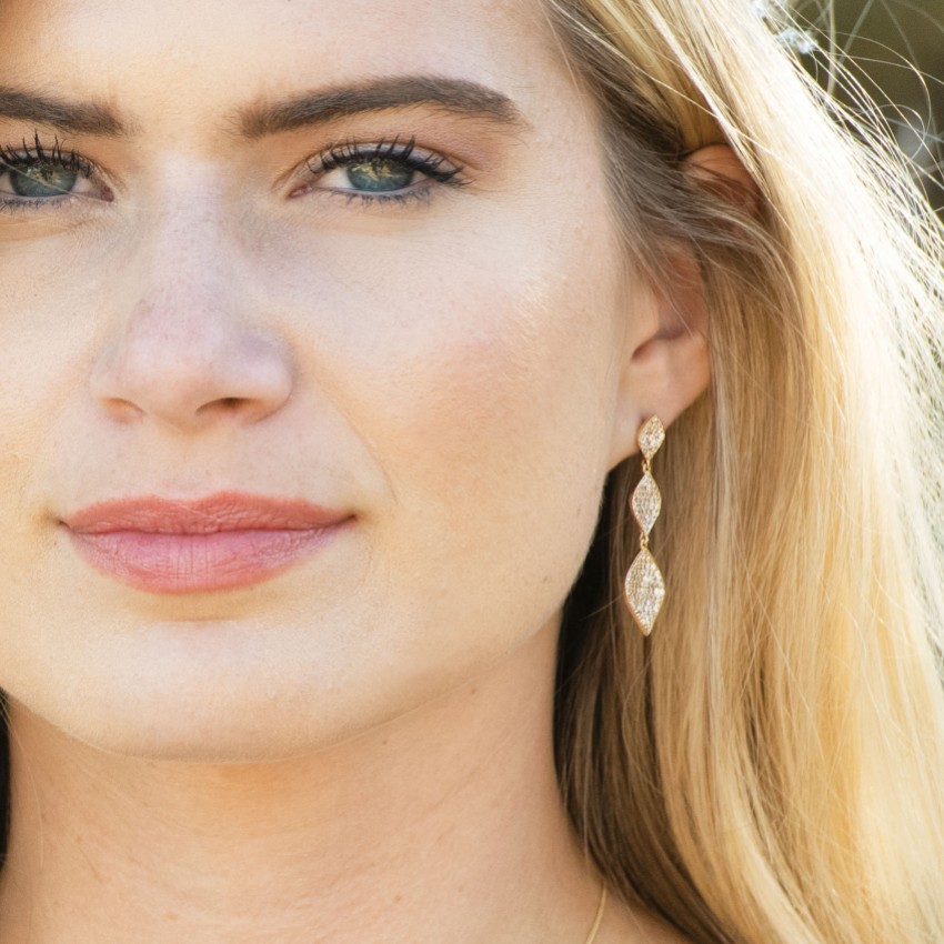 Photograph: Ivory and Co Rochelle Gold Crystal Pave Triple Drop Earrings