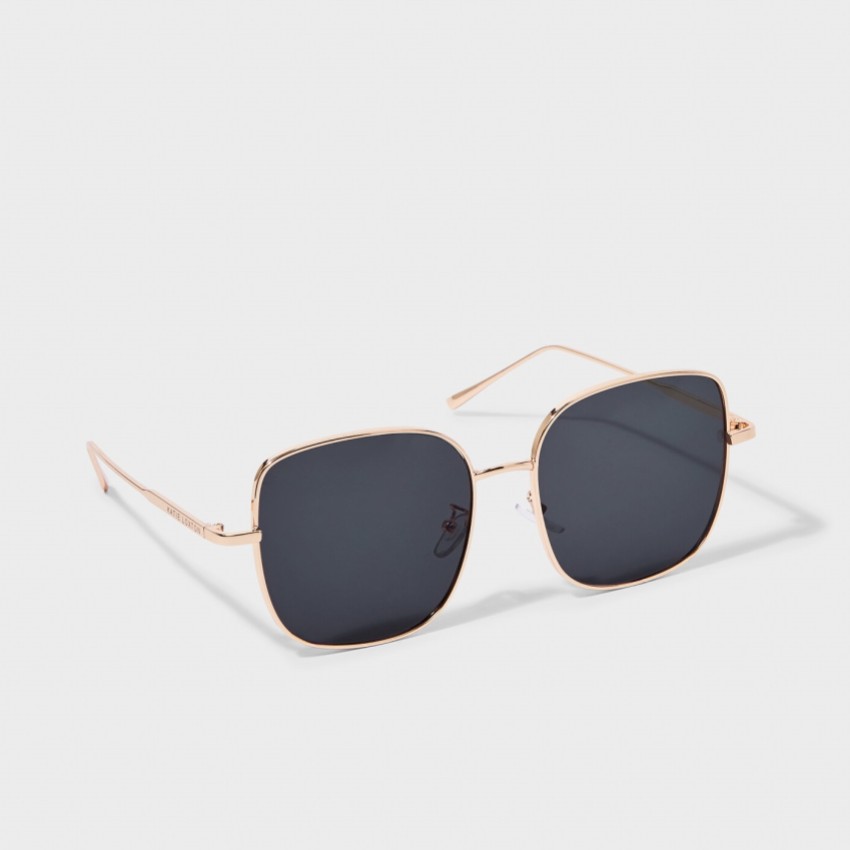 Fotografía: Katie Loxton Gafas de sol cuadradas Sahara en dorado y negro