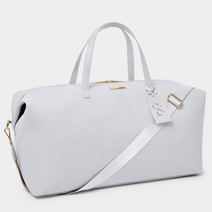 Fotografia: Katie Loxton Mala de viagem azul claro