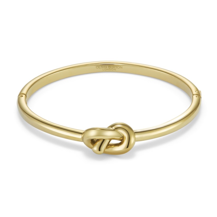 Fotografia: Olivia Burton Pulseira banhada a ouro com o símbolo do nó dos namorados