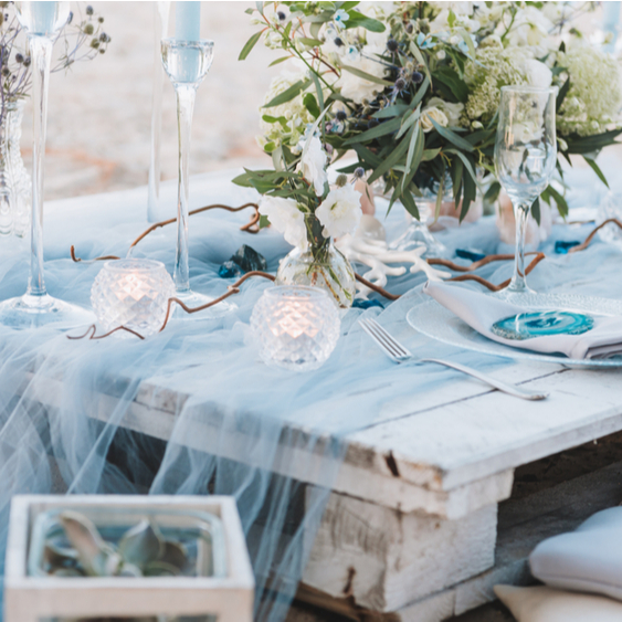 blue table setting with flowers