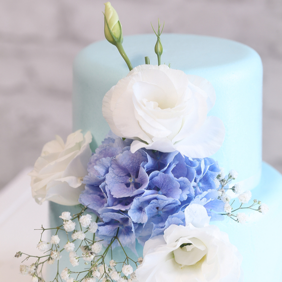 blue wedding cake with flowers