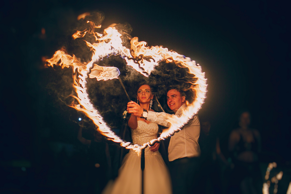 Couple Setting Fire To Heart Ring